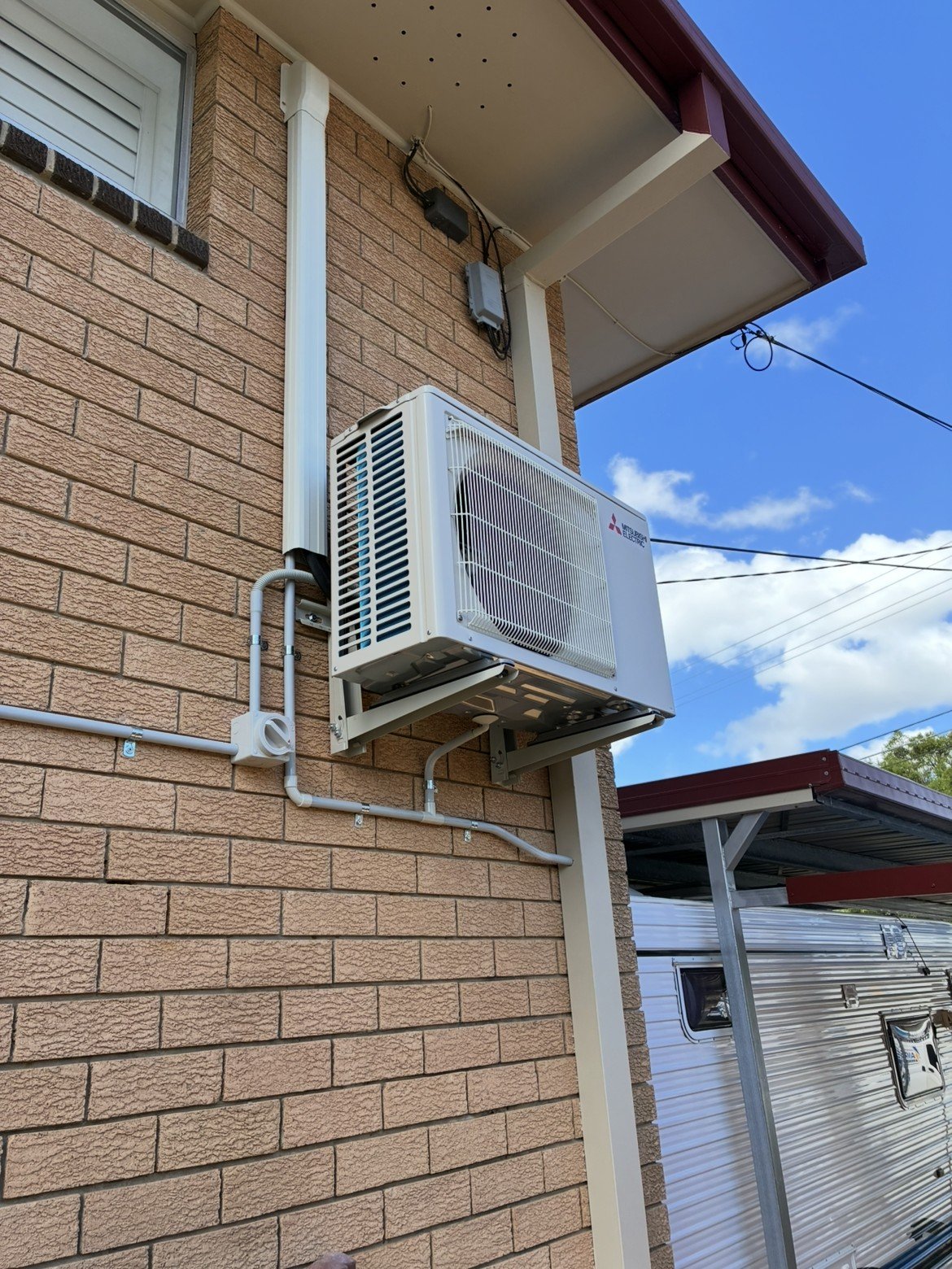 Split system wall-mounted indoor unit installed in living room — Cleveland air conditioning by licensed electrician