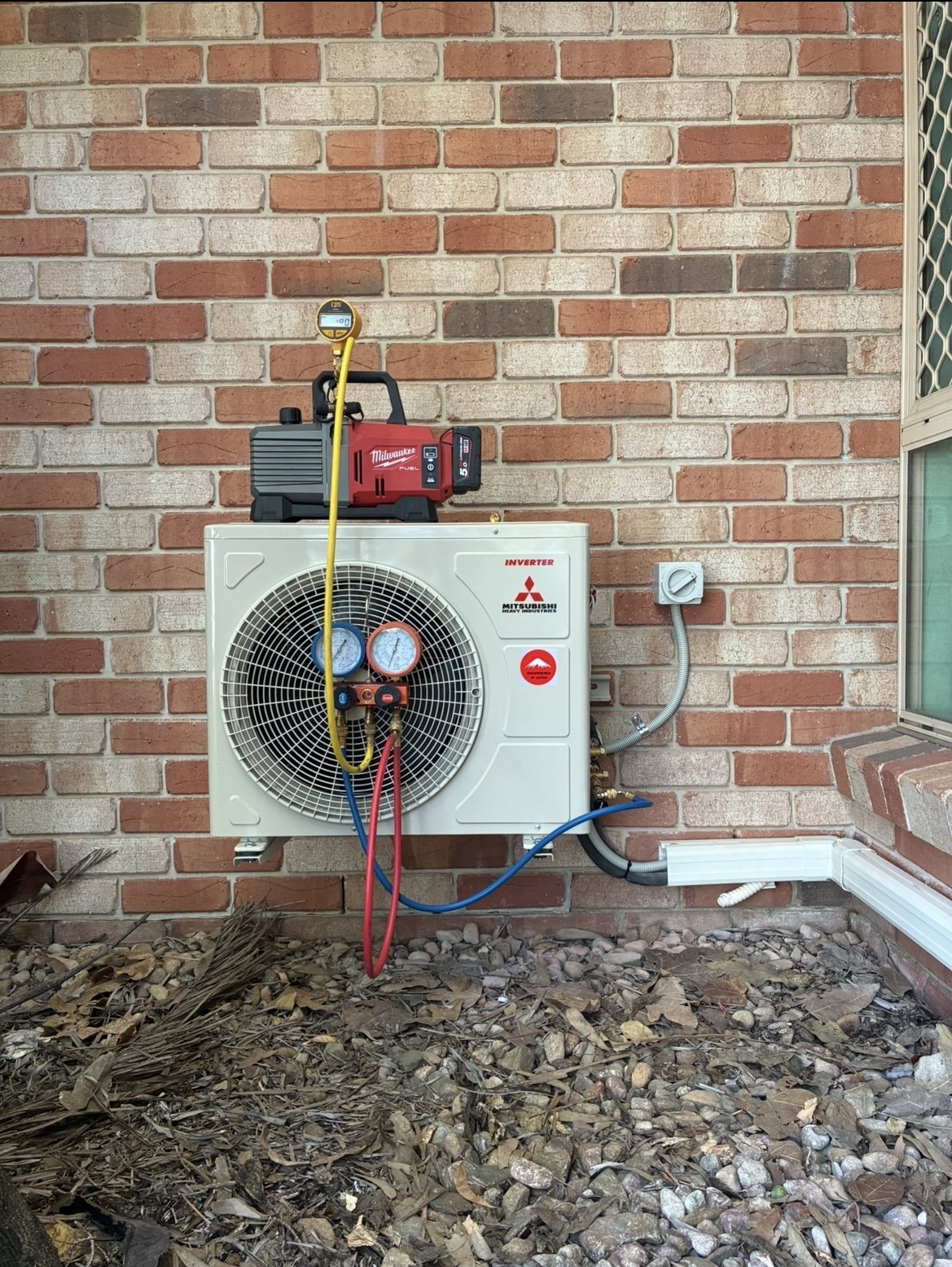 Split system wall-mounted indoor unit installed in living room — Sheldon air conditioning by licensed electrician