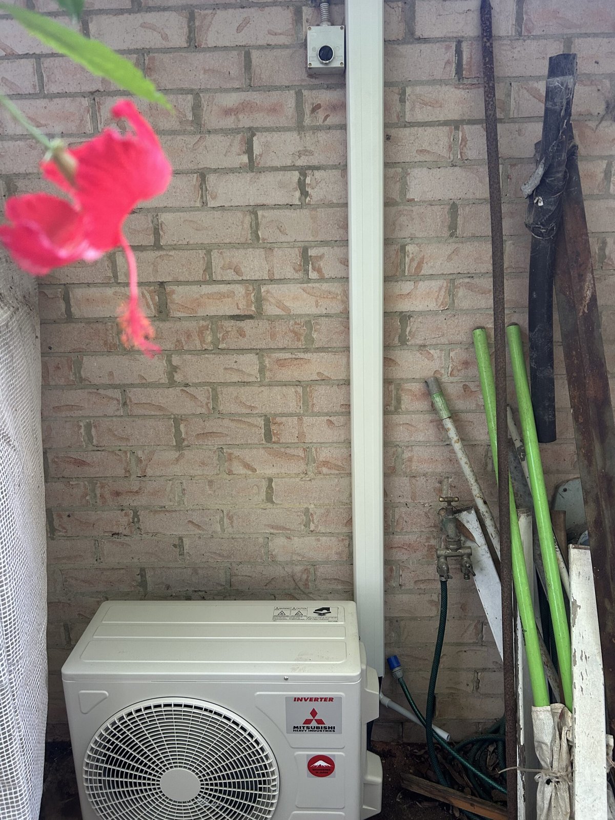 Split system wall-mounted indoor unit installed in living room — Manly air conditioning by licensed electrician