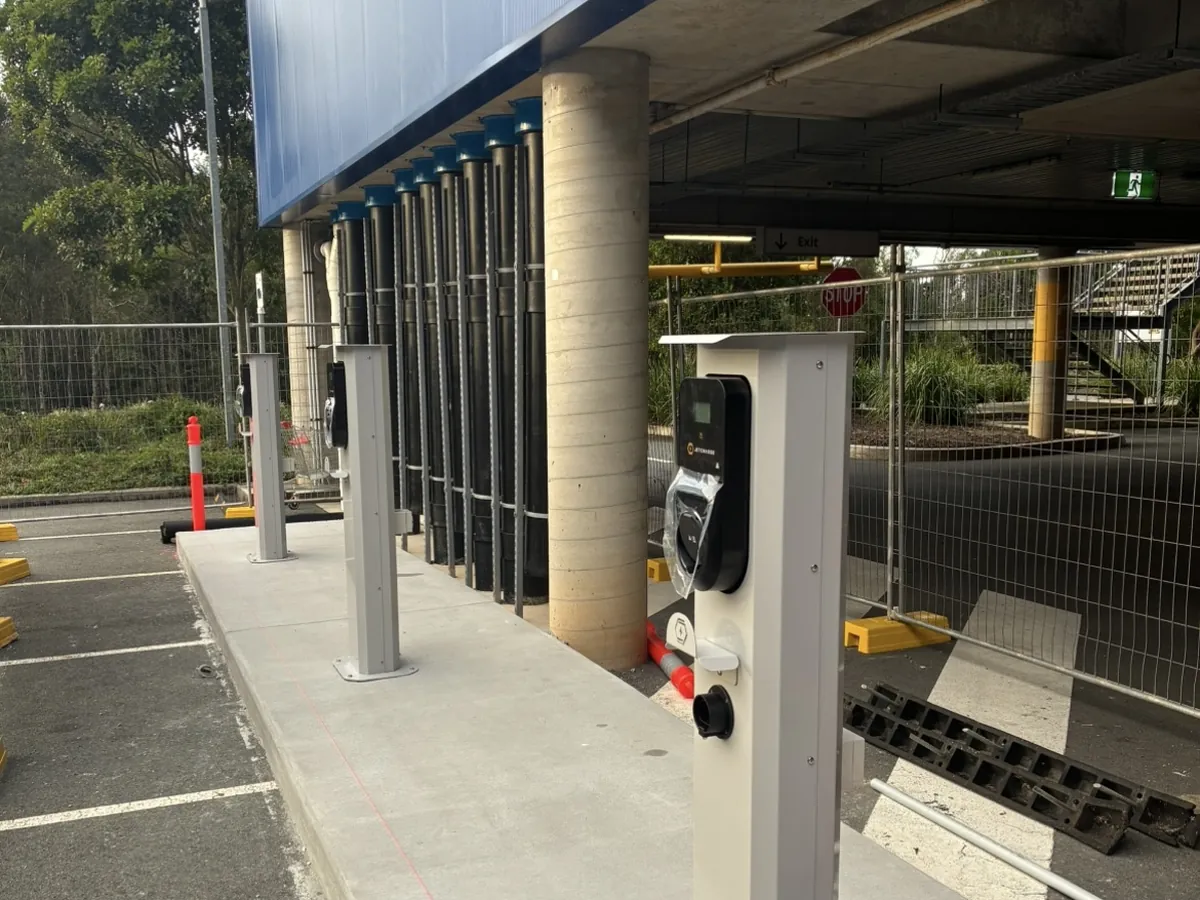 EV charging station installed in a commercial car park in Brisbane by Amplus Electrical & Air