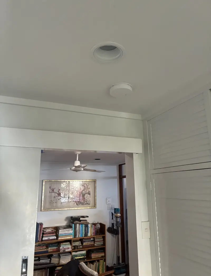Interconnected smoke alarm installed on ceiling of an older Queensland home