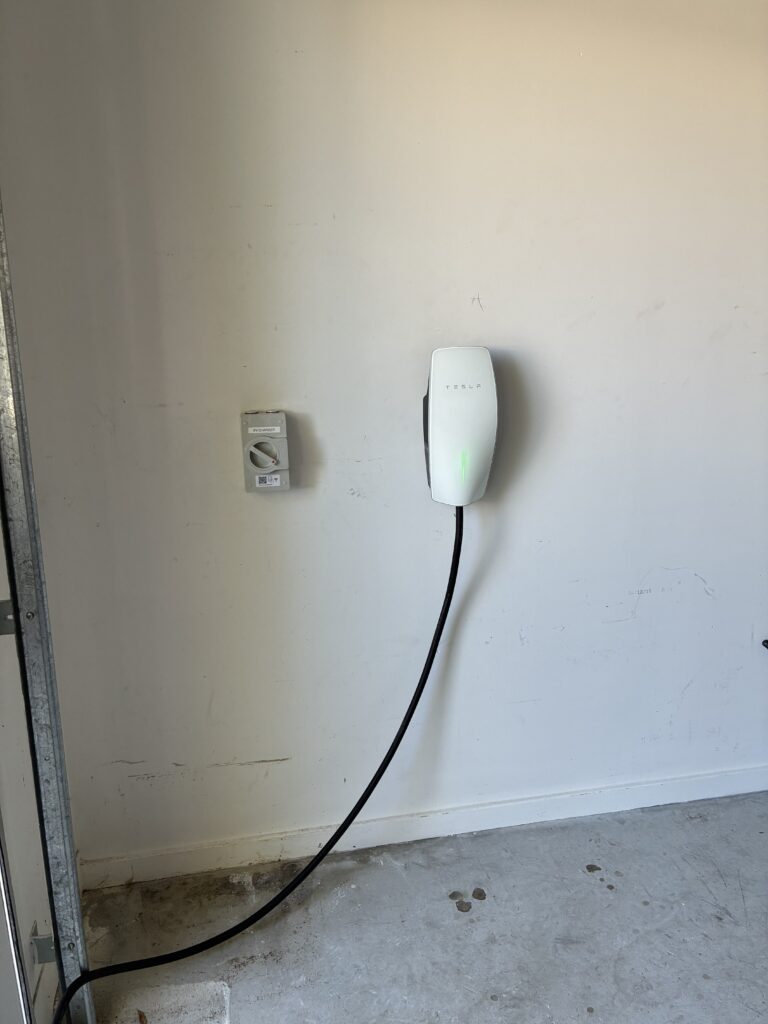 Finished wall-mounted home EV charger installation by Amplus Electrical in Brisbane's Redlands