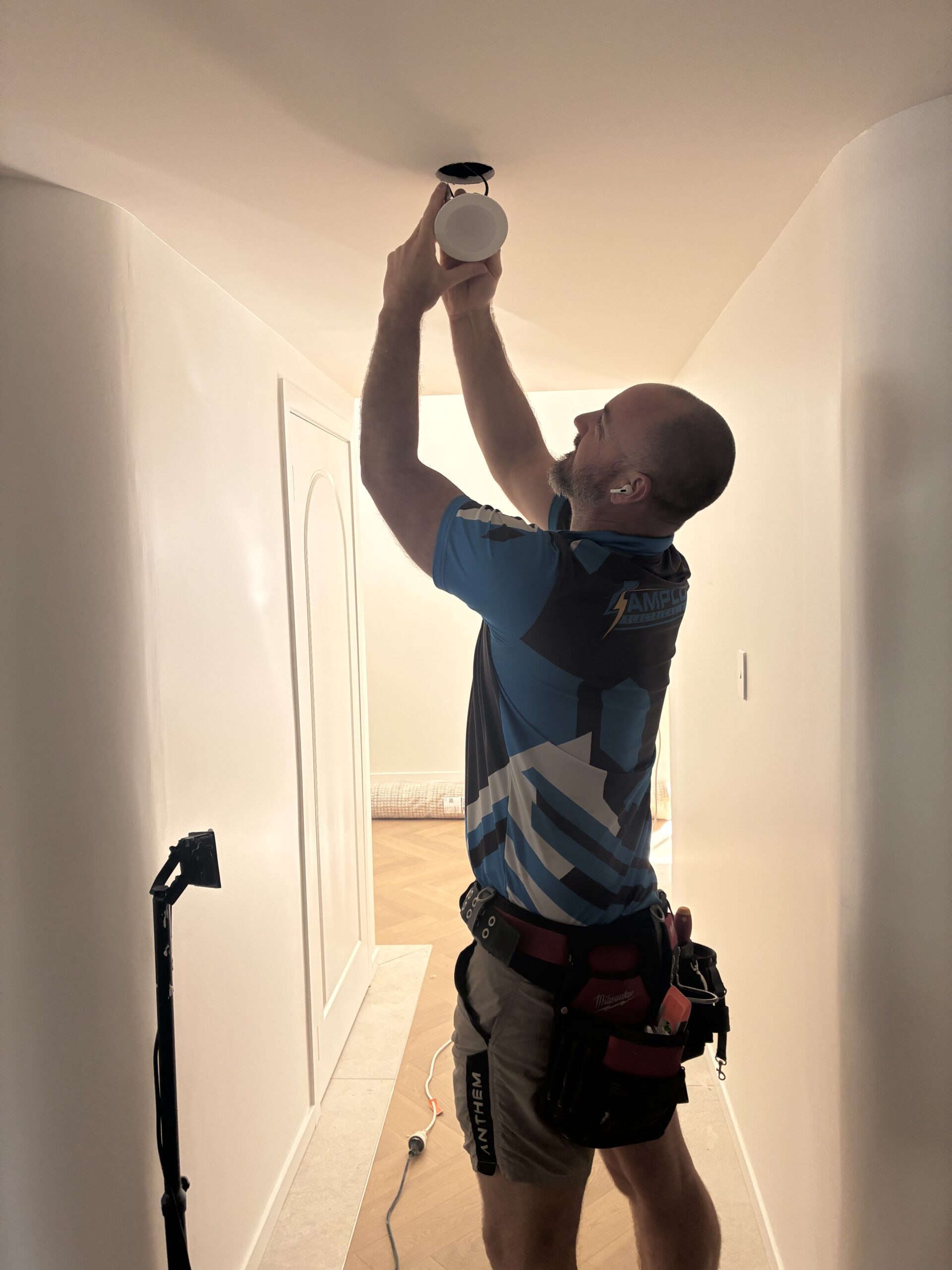 Aaron installing LED downlight in Brisbane home