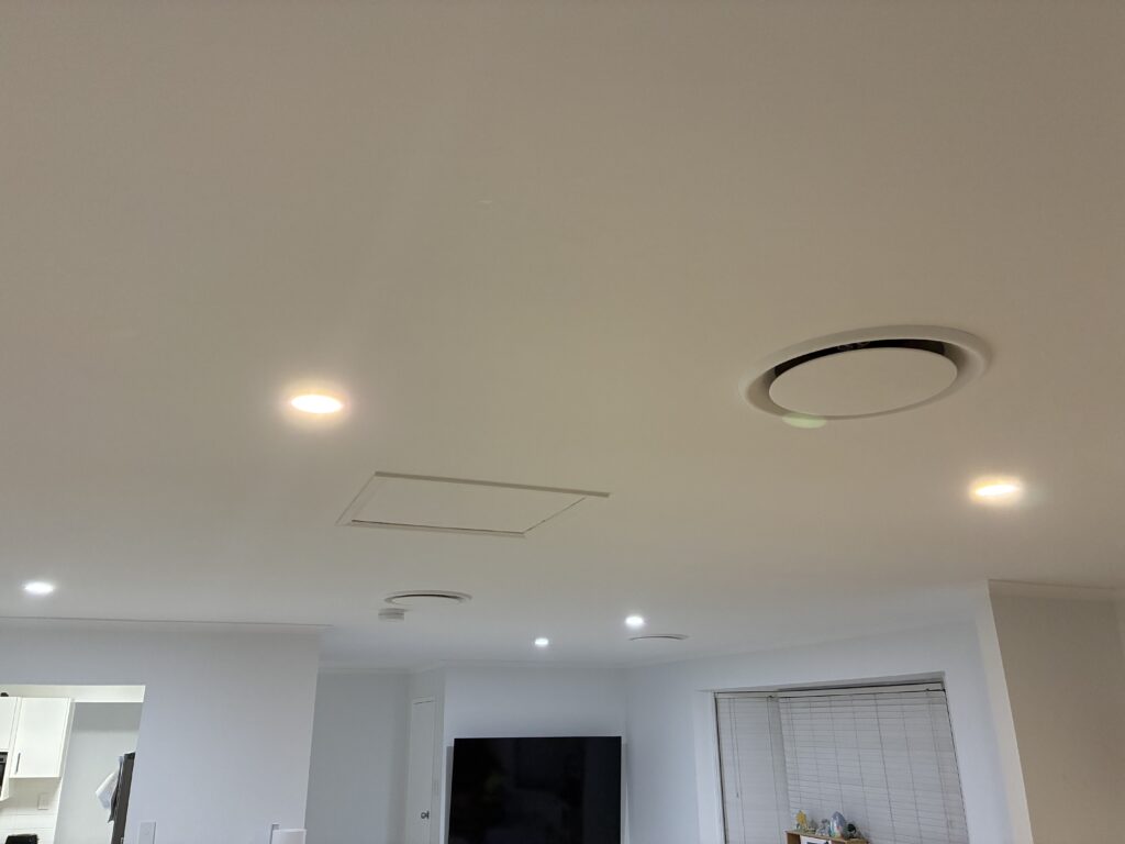 Modern Brisbane home living room with LED downlights installed showing warm 3000K colour temperature