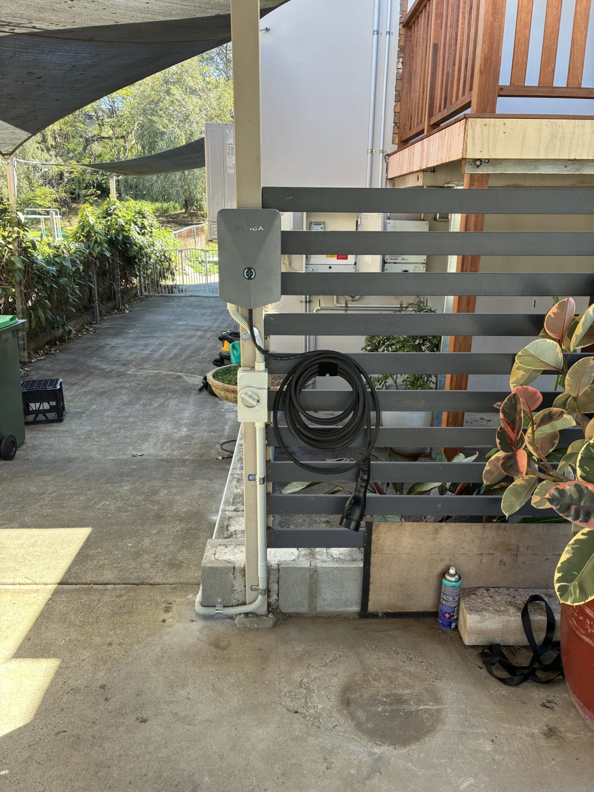 Evnex EV charger installed in a garage with the door open in Brisbane